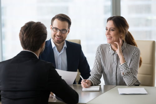 A professional with an Online MA in Organizational Psychology leads a corporate workshop
