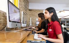 A corporate leader using an Online MBA in AI to analyze predictive business data on a digital interface